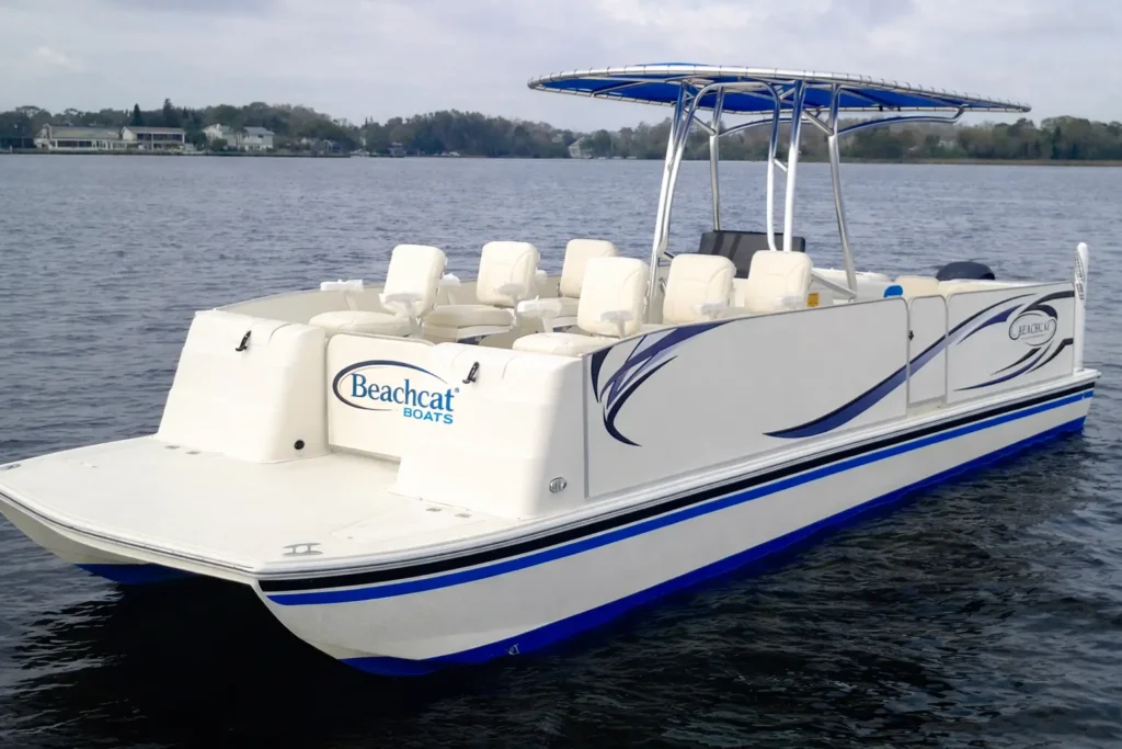 BeachCat luxury pontoon party boat on open water with spacious seating and shaded canopy.